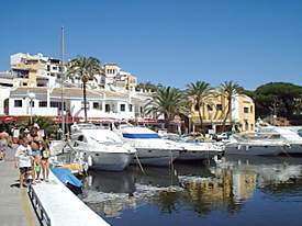 Restaurants and yachts at Cabopino marina and harbour