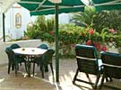 Sunny terrace overlooking garden in Artola Gardens apartment near Cabopino, Costa del Sol