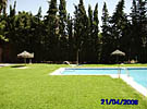 The pool and gardens at Carib Playa apartment near Cabopino, Costa del Sol